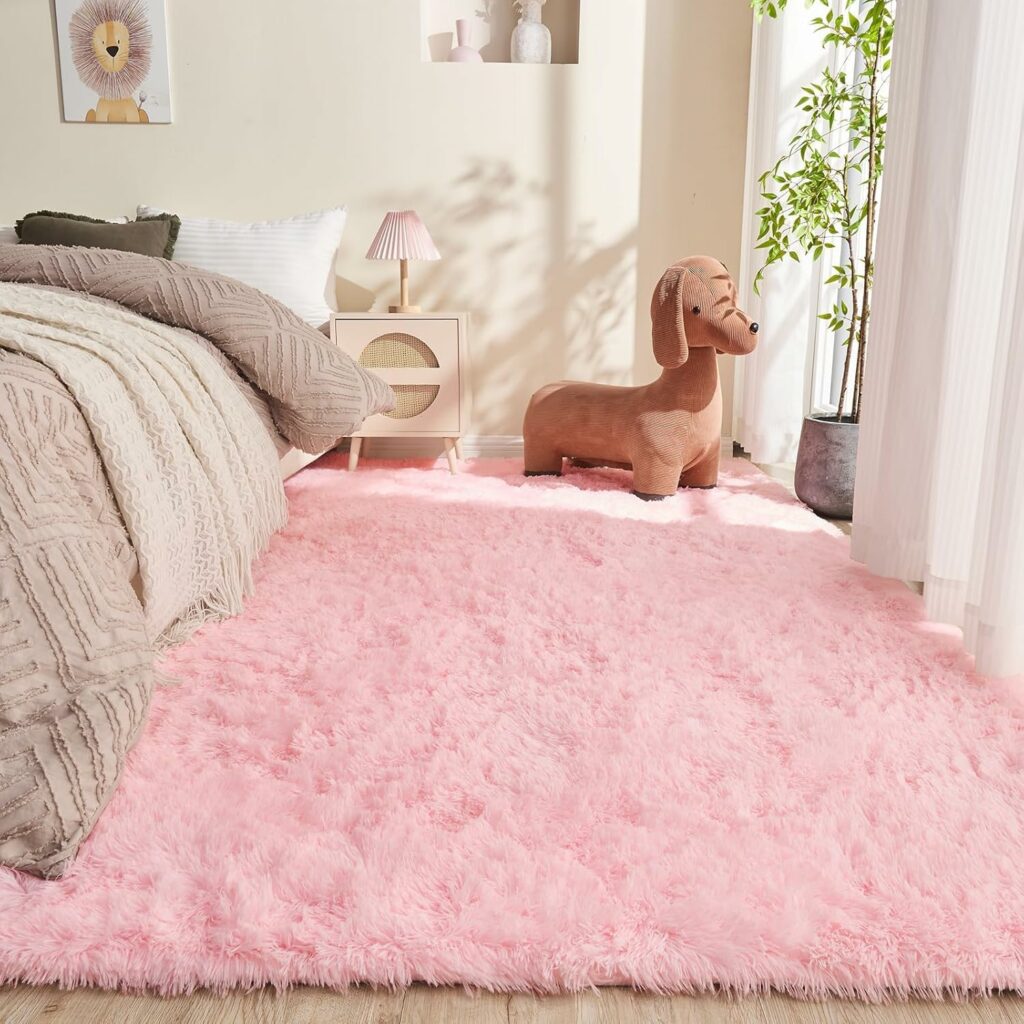 Blush pink shag rug in a minimalist white bedroom