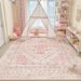 Pink flatweave rug in a colourful teen bedroom